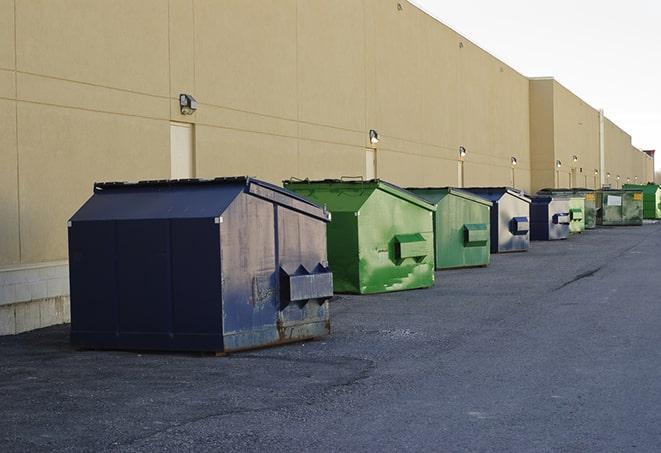 brightly colored dumpsters filled with construction waste in Dania Beach